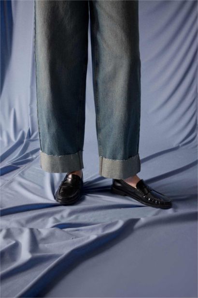 بنطلون جينز باجي فيت برجل عادي وخصر عالي