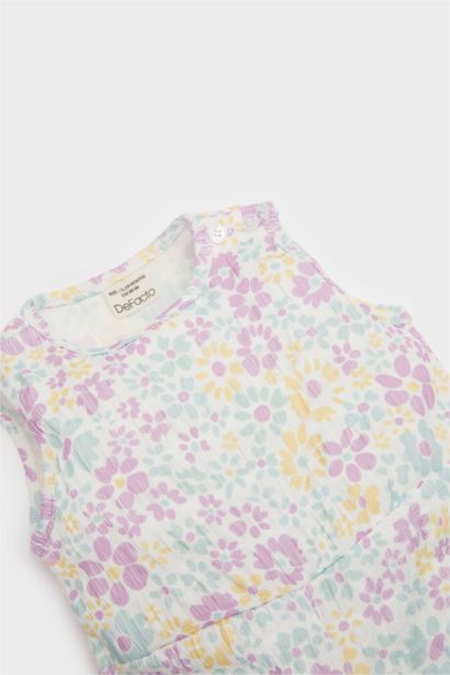 Combinaison fleurie pour bébé fille