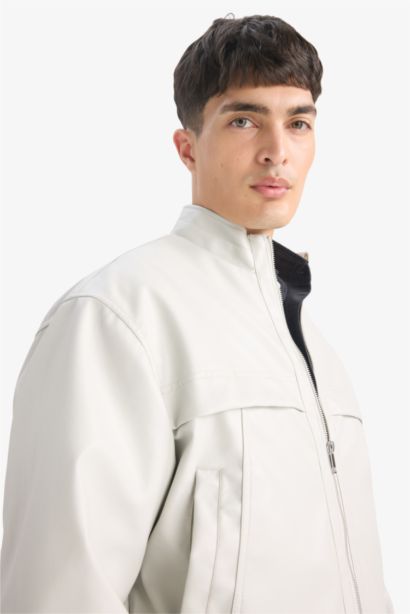 Oversize Fit Stand Collar Zippered Pocket Faux Leather Jacket