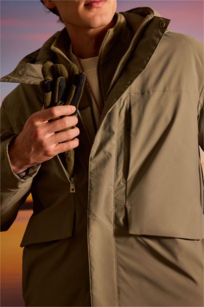 قمصلة نفخ قصة عادية بغطاء للرأس