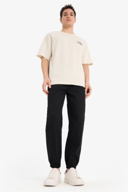 تيشيرت قطن أوفر سايز مطبوع برقبة مستديرة من لوني تونز