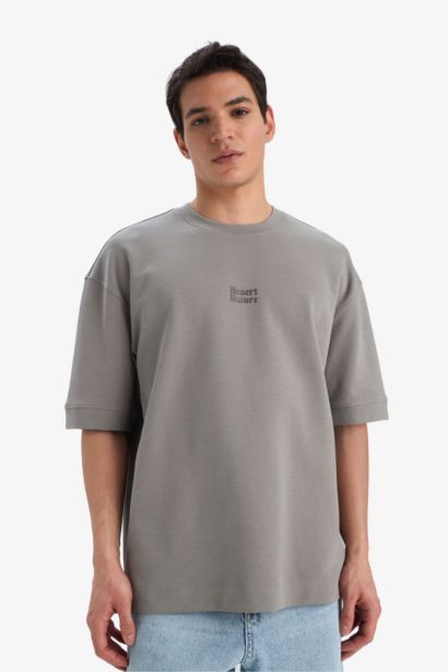 تيشيرت نص كم قصة فضفاضة مطبوع