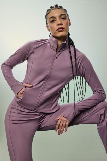 Top de sport manches longues zippé à col montant Coupe slim