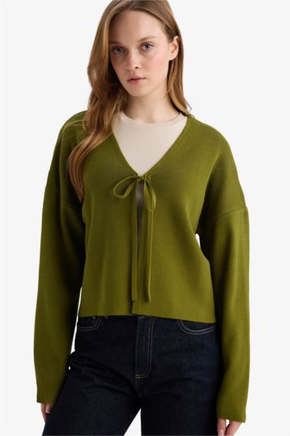 سترة تريكو قصة عادية بياقة V