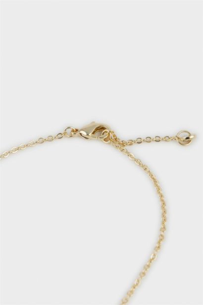 سوار يد ذهبي بأحجار من Reis x DeFacto