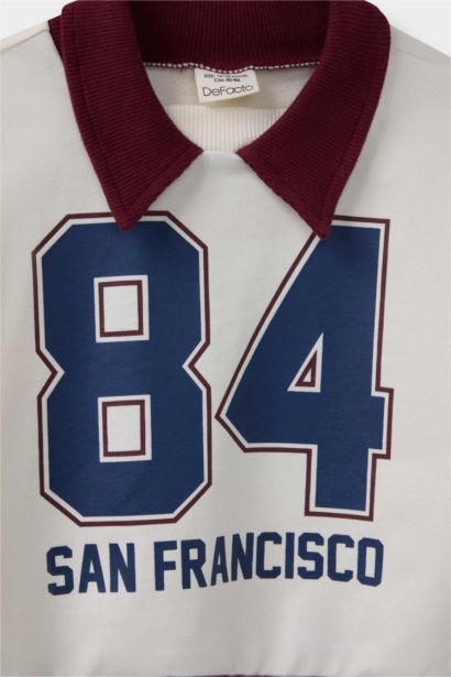 سويت شيرت بيبي أولاد بطبعة شعار قصة عادية برقبة قميص