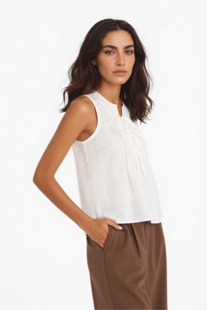 Blouse sans manches à noeuds sur le devant