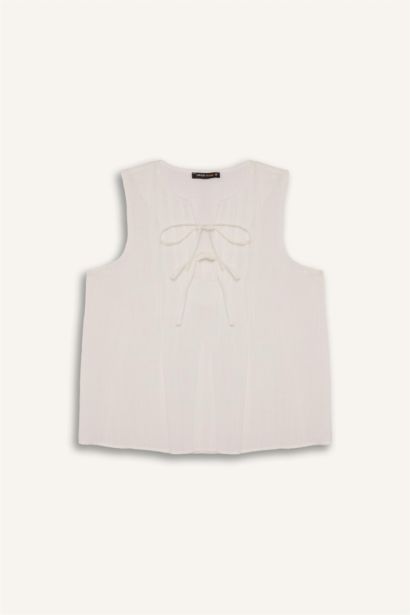 Blouse sans manches à noeuds sur le devant