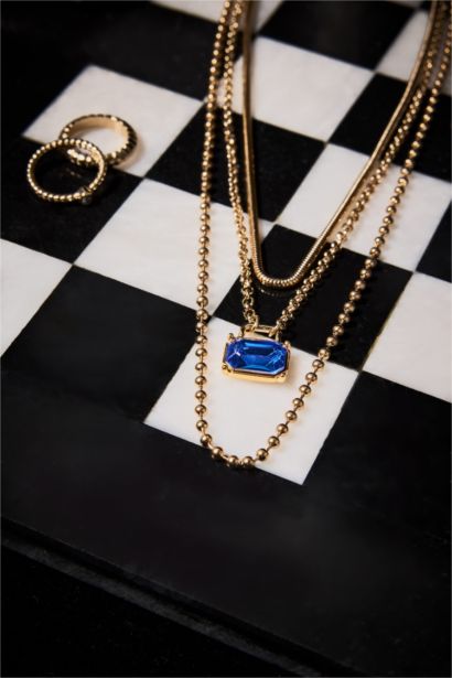 Collier femme doré avec pierre bleue