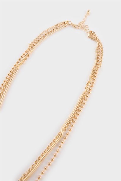 Collier femme doré avec pierre bleue