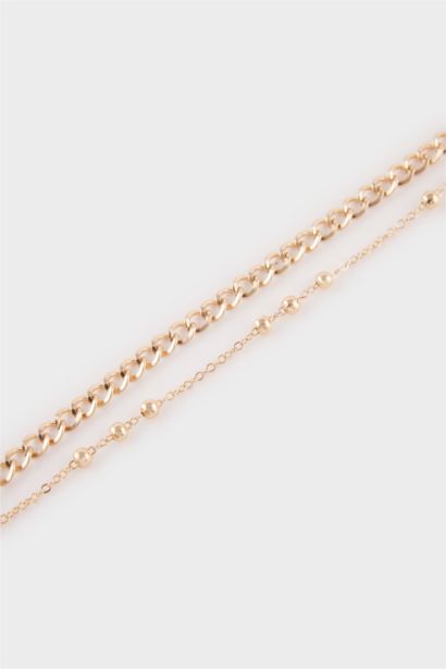 Woman 5 Piece Golden Bracelets With Pearls