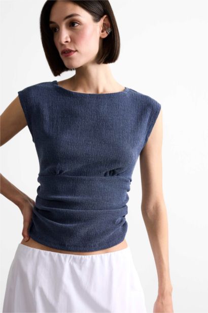 بلوزة كت سادة بياخة مدورة