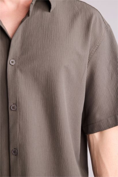 قميص نص ردن بوكسي فيت قماش كرنكيل