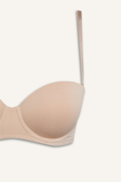 Бюстгальтер без бретелек на косточках с микро покрытием и половинным наполнением