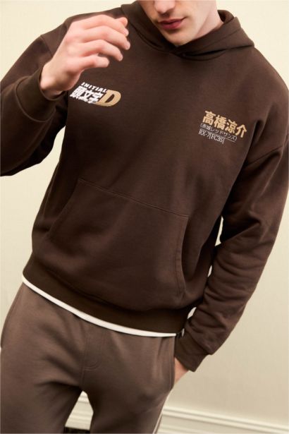 سويت شيرت مطبوع أوفر سايز بغطاء للرأس