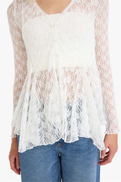 Blouse en dentelle boutonnée à col en V et manches longues