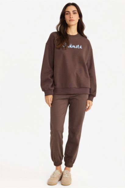 سويت شيرت بطبعة شعار اوفر سايز بياقة مستديرة