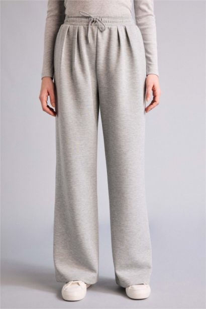 Плиссированные брюки