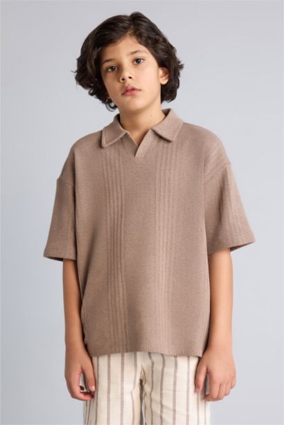 تيشيرت بولو اولادي نص كم اوفر سايز بياقة عالية