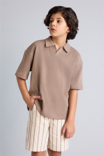 تيشيرت بولو اولادي نص كم اوفر سايز بياقة عالية