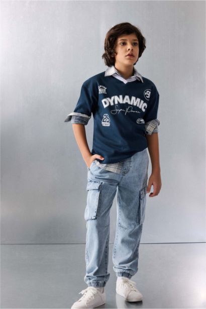 تيشيرت بولو نص ردن بطبعة شعار اوفر سايز وياخة عالية