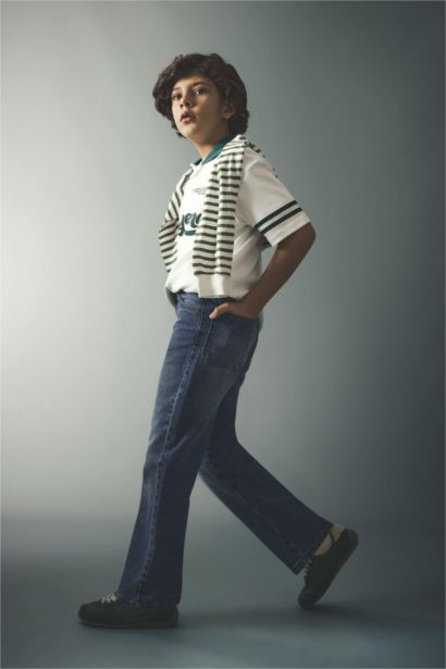 تيشيرت بولو ولادي نص ردن بطبعة شعار اوفر سايز