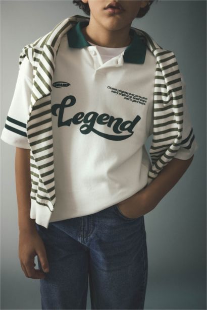 تيشيرت بولو ولادي نص ردن بطبعة شعار اوفر سايز