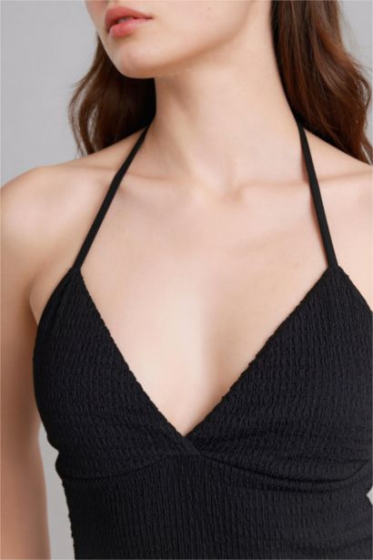 Débardeur froissé asymétrique à col halter