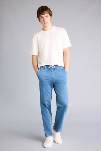 Джинсы Wide Leg с широкими штанинами и снежной стиркой