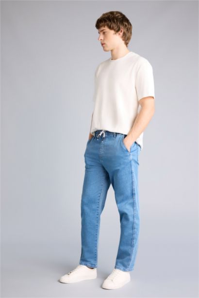 Джинсы Wide Leg с широкими штанинами и снежной стиркой