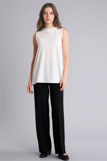 بلوزة كت قطن سليم فيت وياخة مستديرة