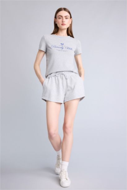 تيشيرت نص كم قصة عادية وياقة مستديرة