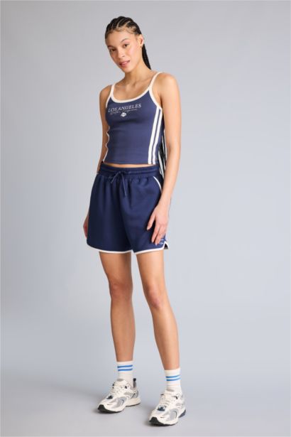 Short de sport NBA Wordmark court en tissu scuba Coupe régulière