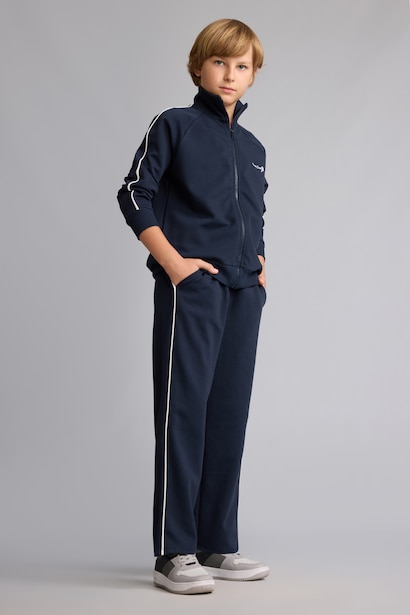 Pantalon de survêtement bleu marine en coton à passepoil blanc pour garçon