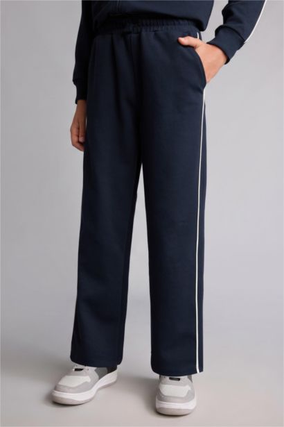 Pantalon de survêtement bleu marine en coton à passepoil blanc pour garçon