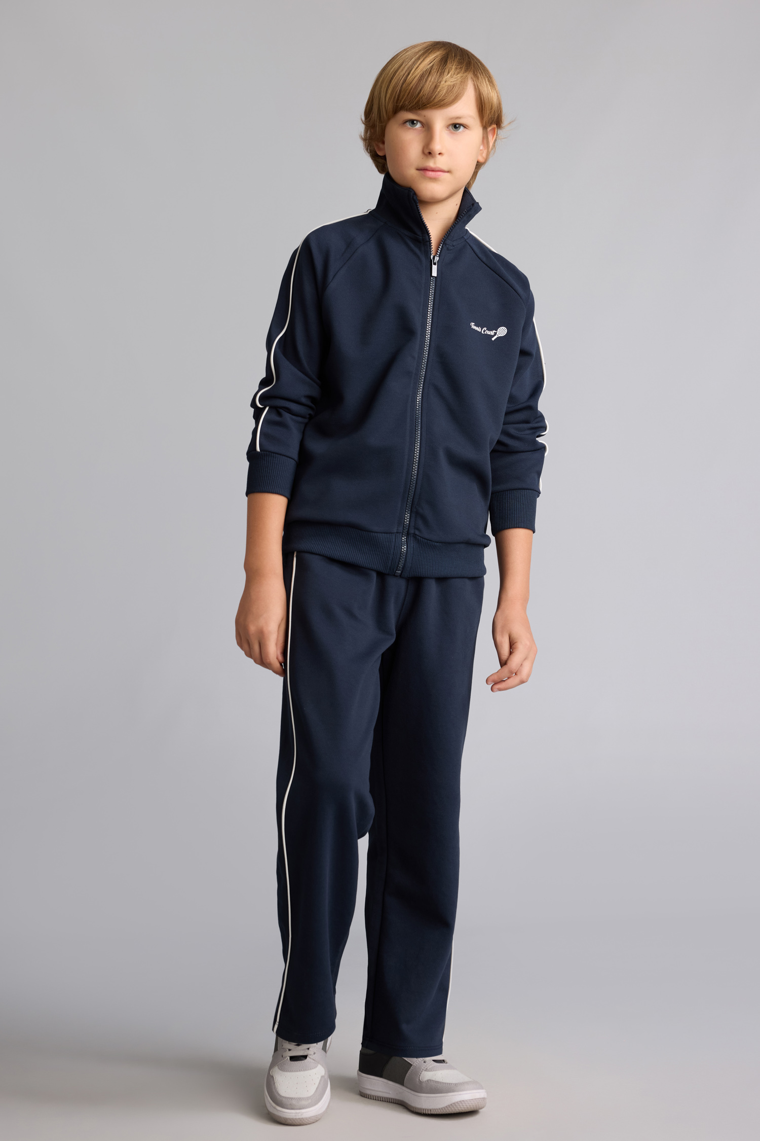 Pantalon de survêtement bleu marine en coton à passepoil blanc pour garçon