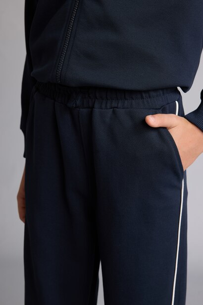 Pantalon de survêtement bleu marine en coton à passepoil blanc pour garçon