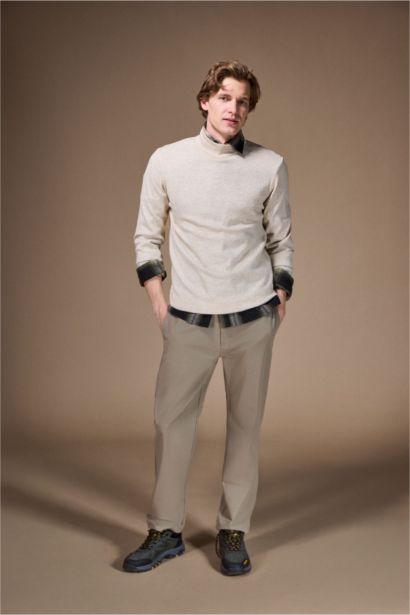 بلوز تريكو سليم فيت بياخة مدورة