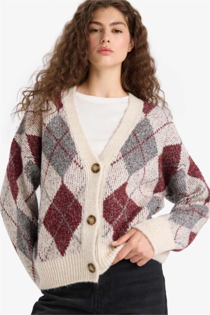 جاكيت تريكو اوفر سايز بياخة V