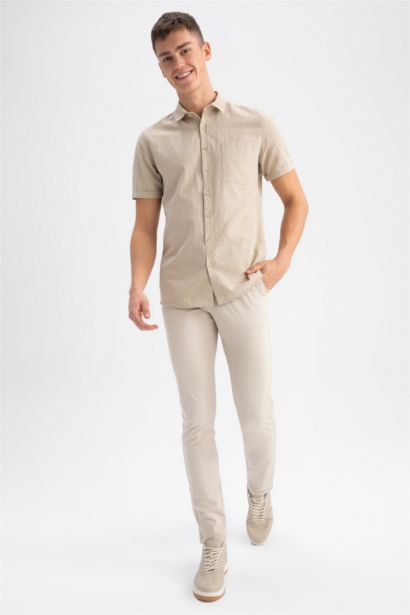 Chemise à manches courtes en 100 % coton, col polo, coupe slim