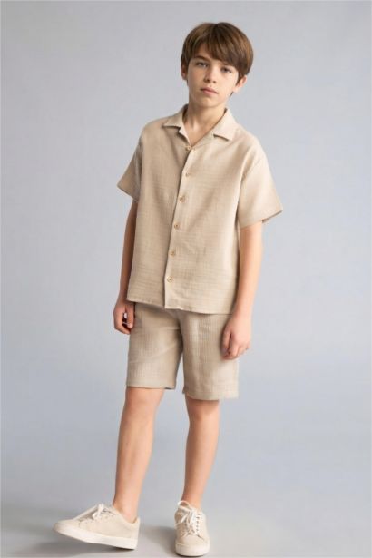 قميص نص كم موسلين اوفر سايز بياقة بولو