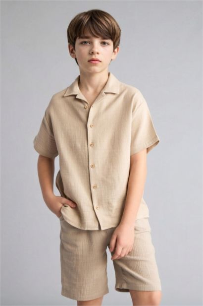 قميص نص كم موسلين اوفر سايز بياقة بولو