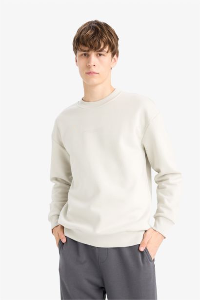 سويت شيرت اوفر سايز بطباعة وياخة مستديرة