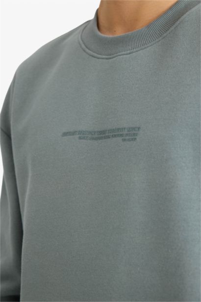 سويت شيرت اوفر سايز برقبة مستديرة وطبعة