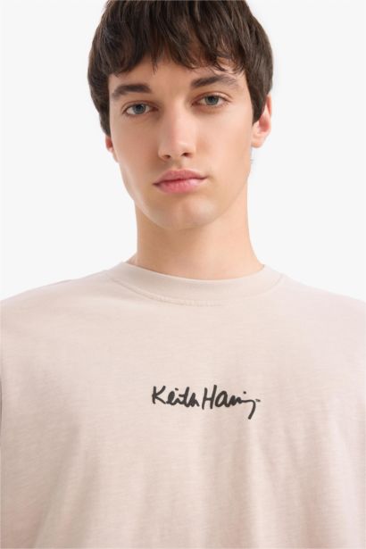 تيشيرت قطن قصة مريحة مطبوع برقبة مستديرة من كيث هارينغ