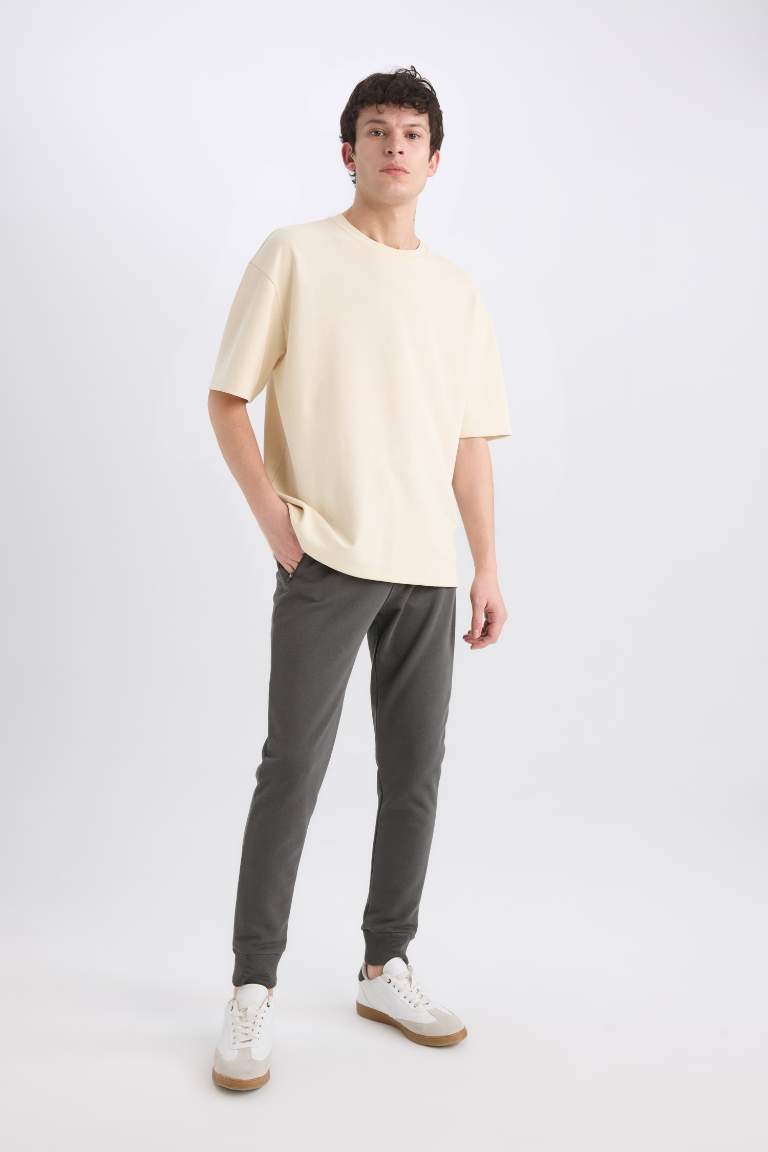 Pantalon de jogging slim à taille élastique et poches zippées