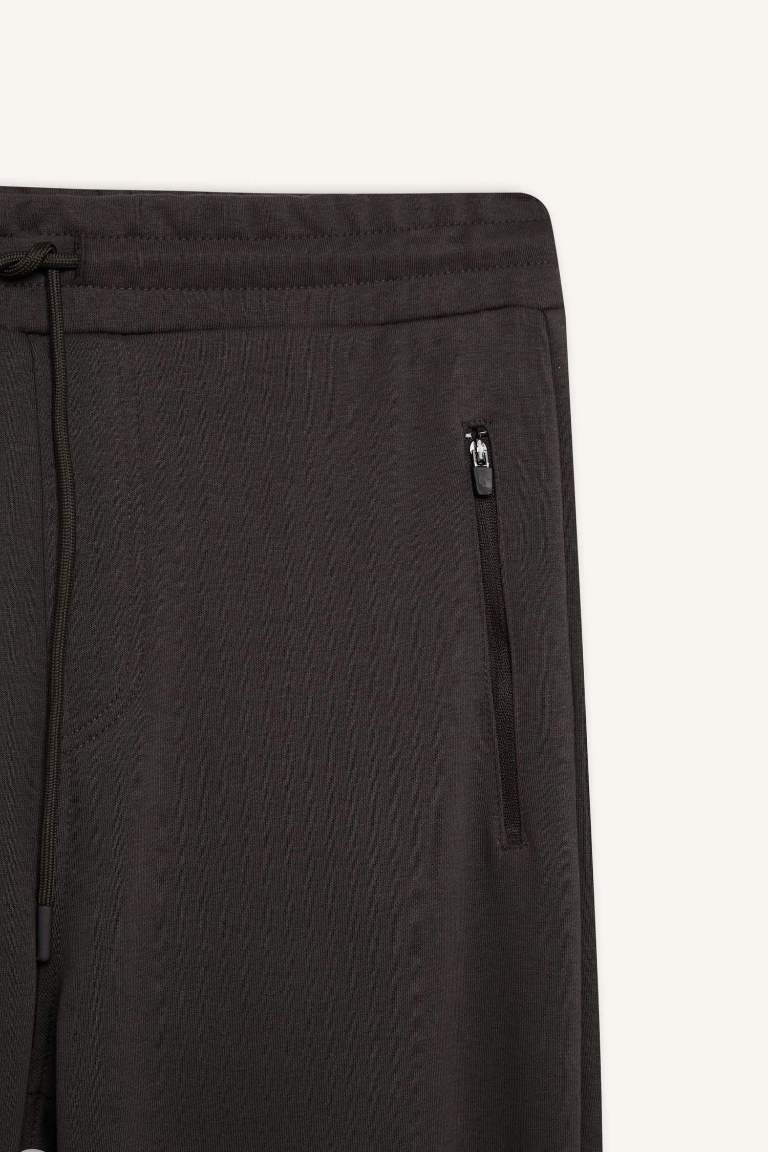 Pantalon de jogging slim à taille élastique et poches zippées