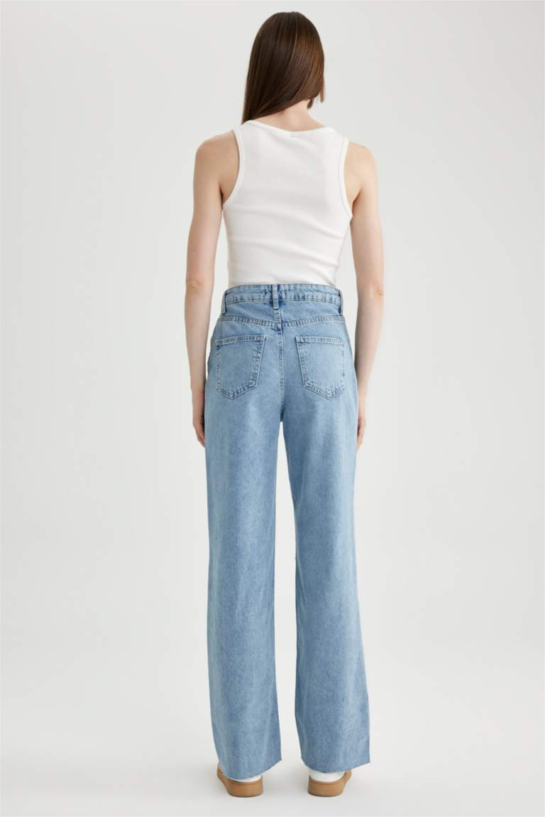 بنطلون جينز 90’S برجل واسع ممزق