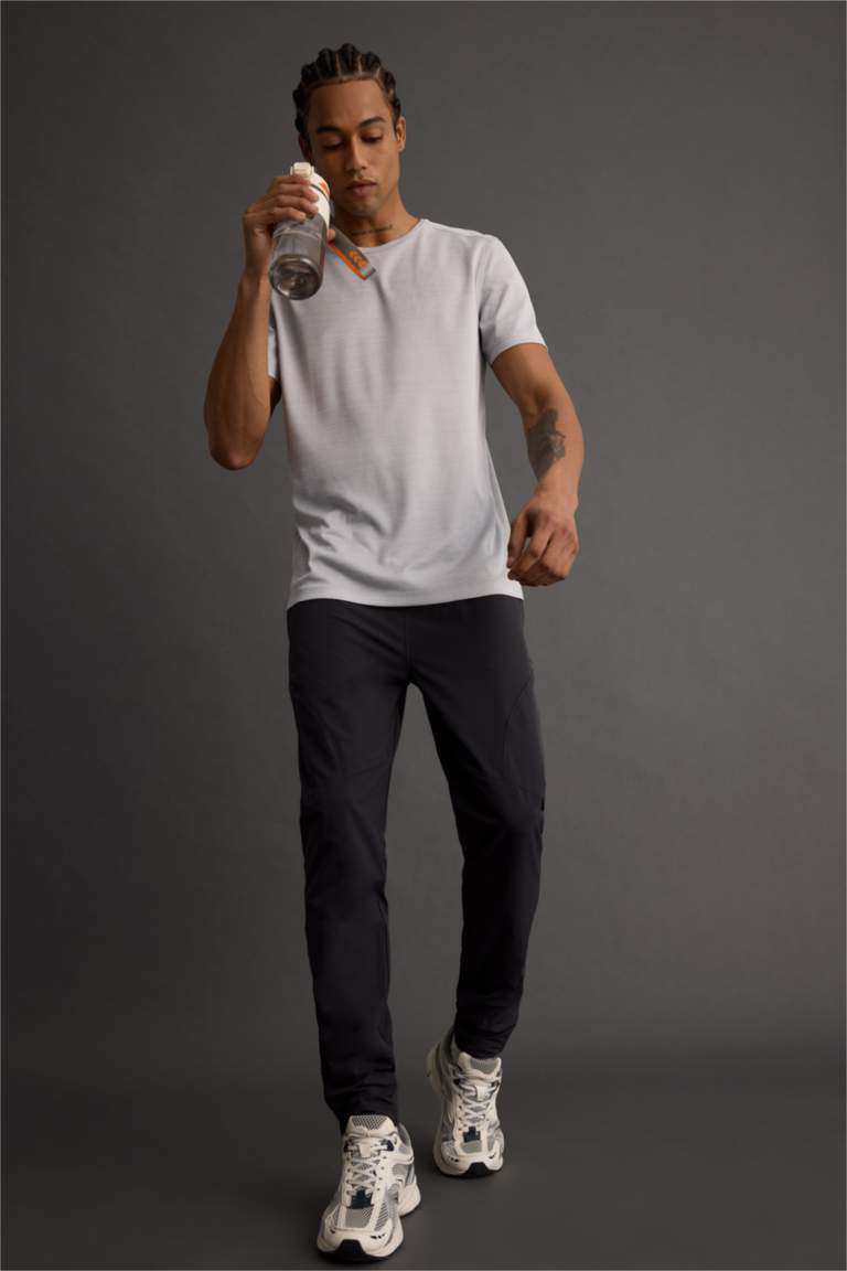 DeFactoFit Slim Fit Dar Kesim Çift Cepli Fermuarlı Paça Dokuma Jogger