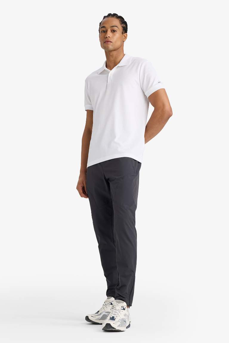 DeFactoFit Slim Fit Dar Kesim Çift Cepli Fermuarlı Paça Dokuma Jogger